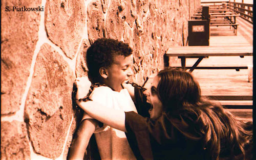 [young boy getting attacked outside castle]